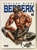 Couverture Berserk Tome 2, manga de Kentaro Miura, personnage musclé blessé avec bras mécanique.