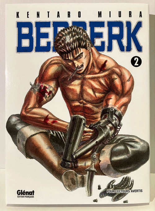 Couverture Berserk Tome 2, manga de Kentaro Miura, personnage musclé blessé avec bras mécanique.