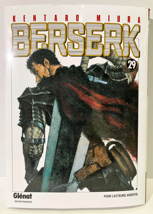 Couverture Berserk tome 29 Glénat, guerrier en armure avec épée et cape rouge.