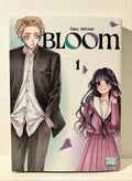 Couverture manga Bloom tome 1 avec un garçon en uniforme noir et une fille en uniforme rose.