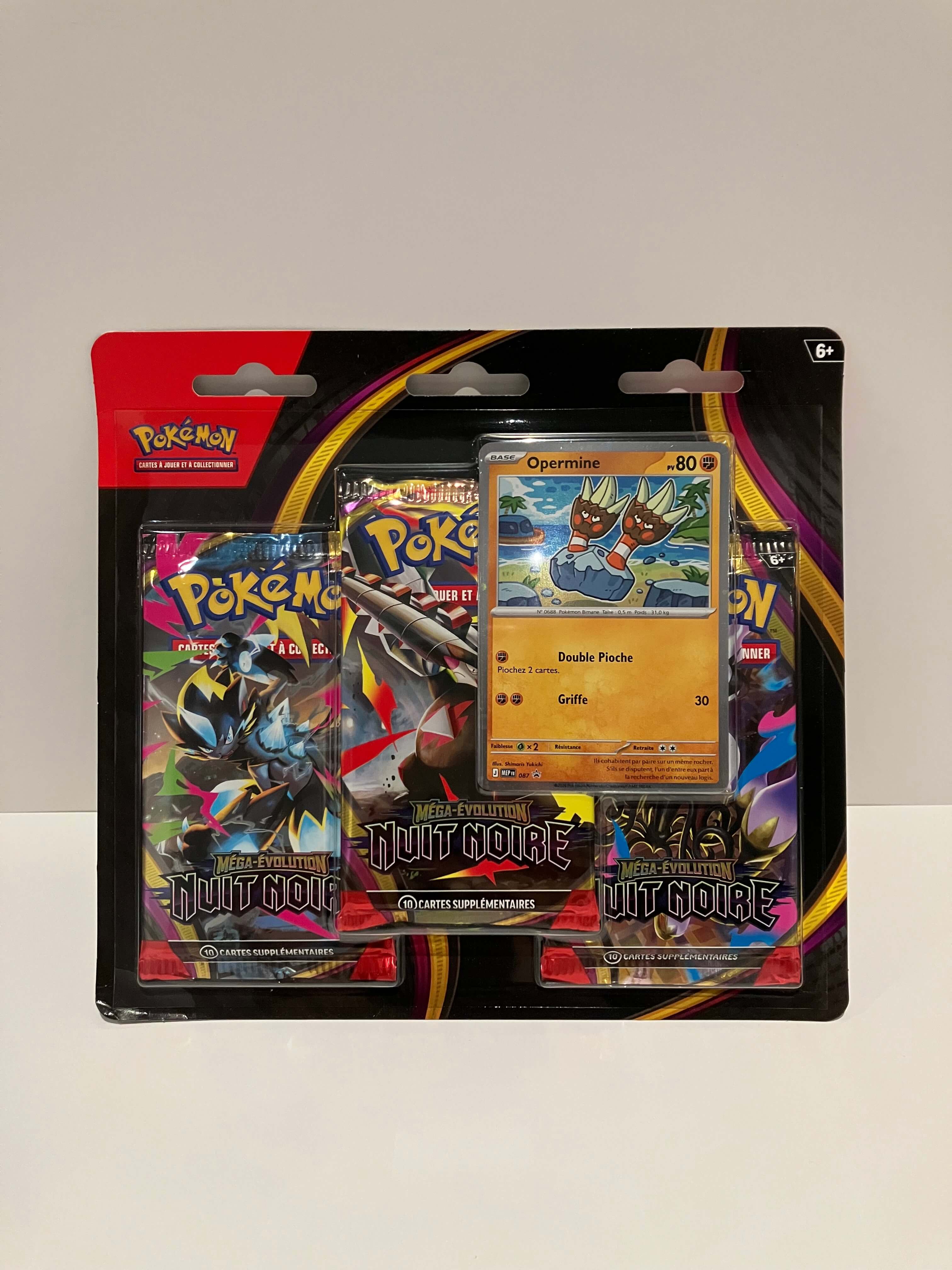 Carte Pokémon Tripack Nuit Noire ME05 contient 3 boosters de Nuit Noire et une carte promo