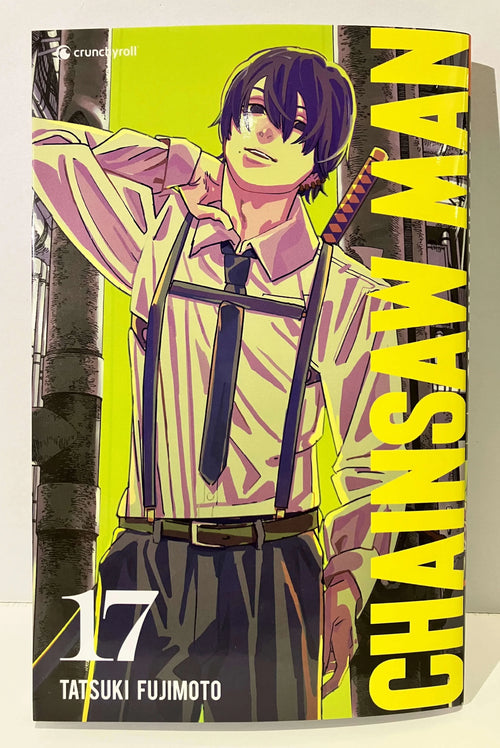Couverture Chainsaw Man tome 17, personnage en chemise, fond jaune, manga Tatsuki Fujimoto.