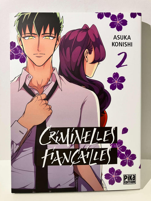 Couverture manga Criminelles Fiançailles tome 2 avec deux personnages, fleurs violettes, Asuka Konishi