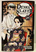 Couverture Demon Slayer tome 21, deux personnages en kimono devant un décor japonais.