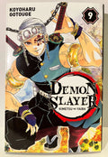 Couverture manga Demon Slayer tome 9, personnage avec sabres et bandeau, style shonen japonais