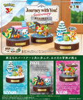 une display de 3 figurines pokémon Journey with You Anniversary A New Journey Begins