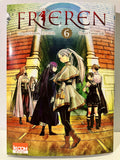 Couverture du manga Frieren tome 6 avec personnages en vêtements fantasy devant un portail