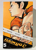 Couverture du manga Haikyū tome 5, joueur de volley en action avec filet sur fond orange