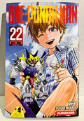 Couverture One Punch Man tome 22, garçon souriant tenant un robot et une figurine Saitama.