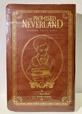 Couverture The Promised Neverland Tome 2 Édition Grace Field, design doré sur fond marron.