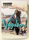 Couverture du manga Vagabond tome 34 avec un samouraï et logo bleu, édition Delcourt